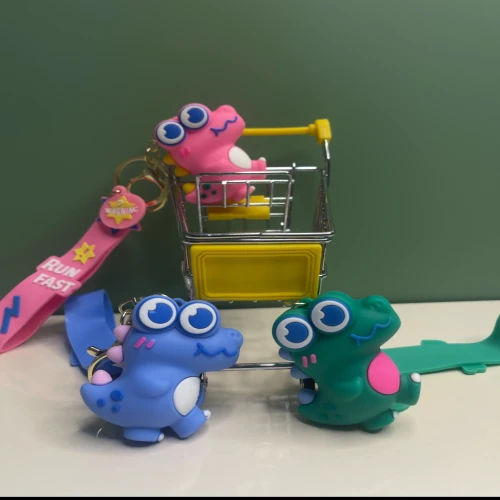 جاکلیدی سیلیکونی طرح دایناسور بامزه با رنگ‌های پاستیلی و طراحی فانتزی، مناسب برای کلید، کیف و کوله‌پشتی.